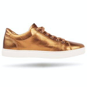 Golden sneakers isolated isolated on white. Luxury